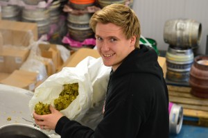 Ethan adding hops to 1000th brew